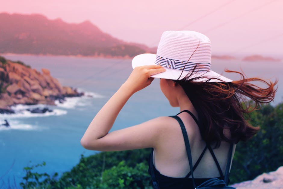 girl in hat at sunset